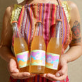 tres botellas chica booch 355 ml té negro.