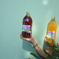 dos botellas 960 chica booch té negro y té oolong, sabores de temporada. 